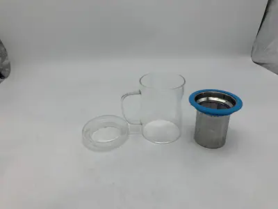 SUYIKA TOMOTIME GLAS TEETASSE MIT DECKEL UND EDELSTAHL-EI KORB - – neu – Möbel – überwiegend silber – Foto 1 von 4